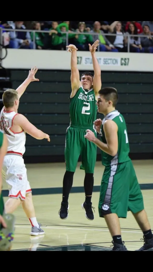 Gage Sampson in game action during a high school basketball game for the Green Bobcats