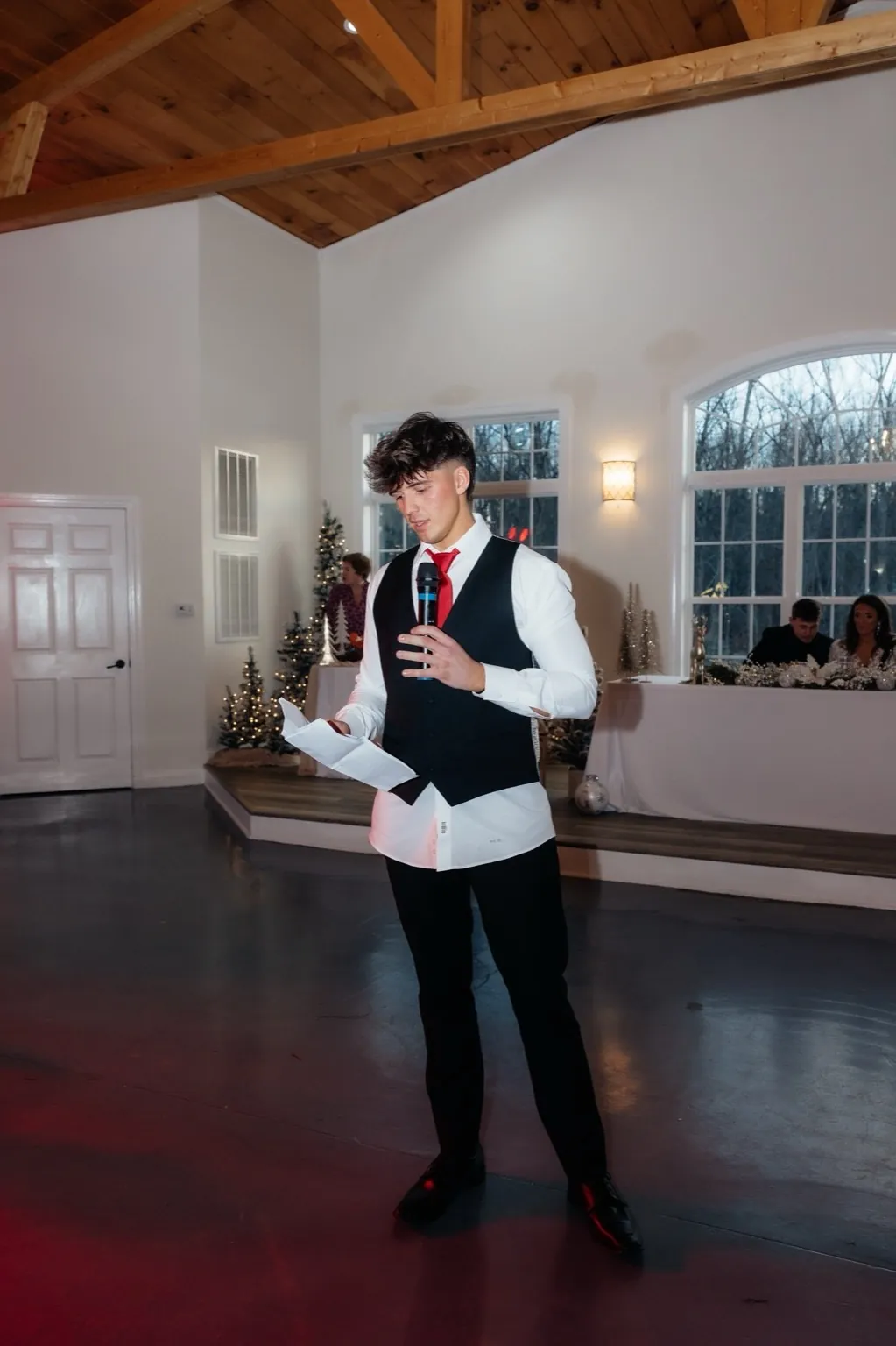 Gage Sampson giving a best man speech at a wedding