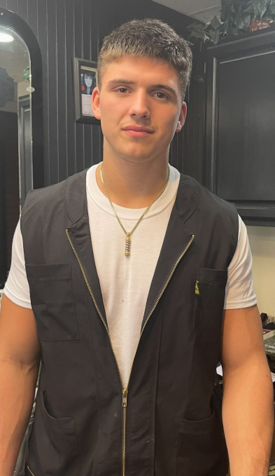 Gage Sampson as a barber